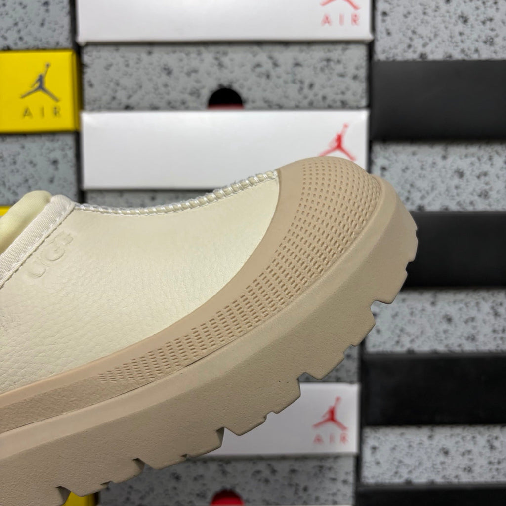 UGG Neumeel Deco Slip-On – Leather Moccasin Sneaker with Cream Lug Sole & Rope Drawstring in Cream